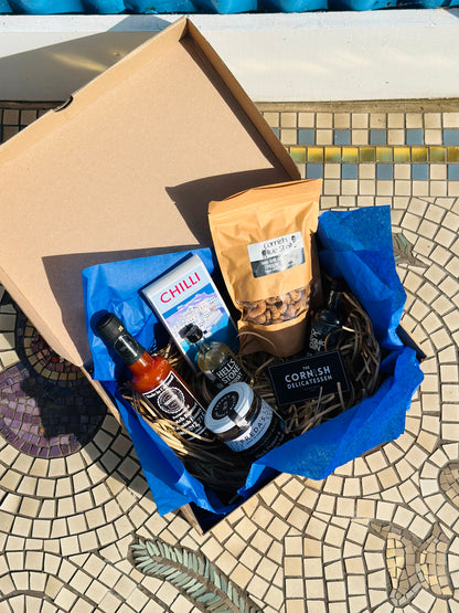 Hot Stuff gift box, including chilli chocolate, mini gin and whisky, salt and pepper peanut butter and a hot sauce.