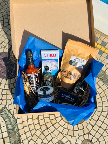 Hot Stuff gift box, including chilli chocolate, mini gin and whisky, salt and pepper peanut butter and a hot sauce.