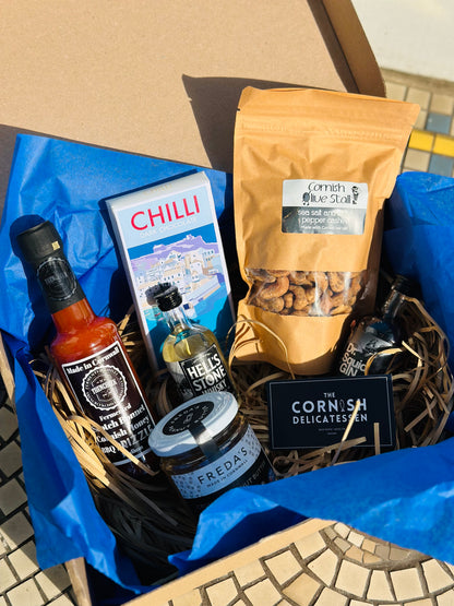 Hot Stuff gift box, including chilli chocolate, mini gin and whisky, salt and pepper peanut butter and a hot sauce.