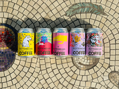 Five colourful cans of Potterbeans Coffee.